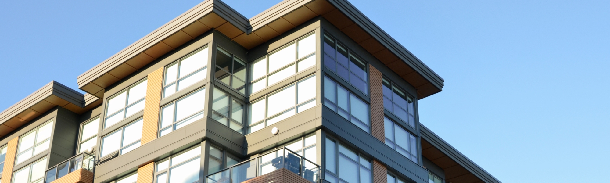 Exterior of a modern UK residential property designed for supported living, representing the hands-off, asset-backed income model discussed in the blog about creating passive income through Assisted Living Units (ALUs).